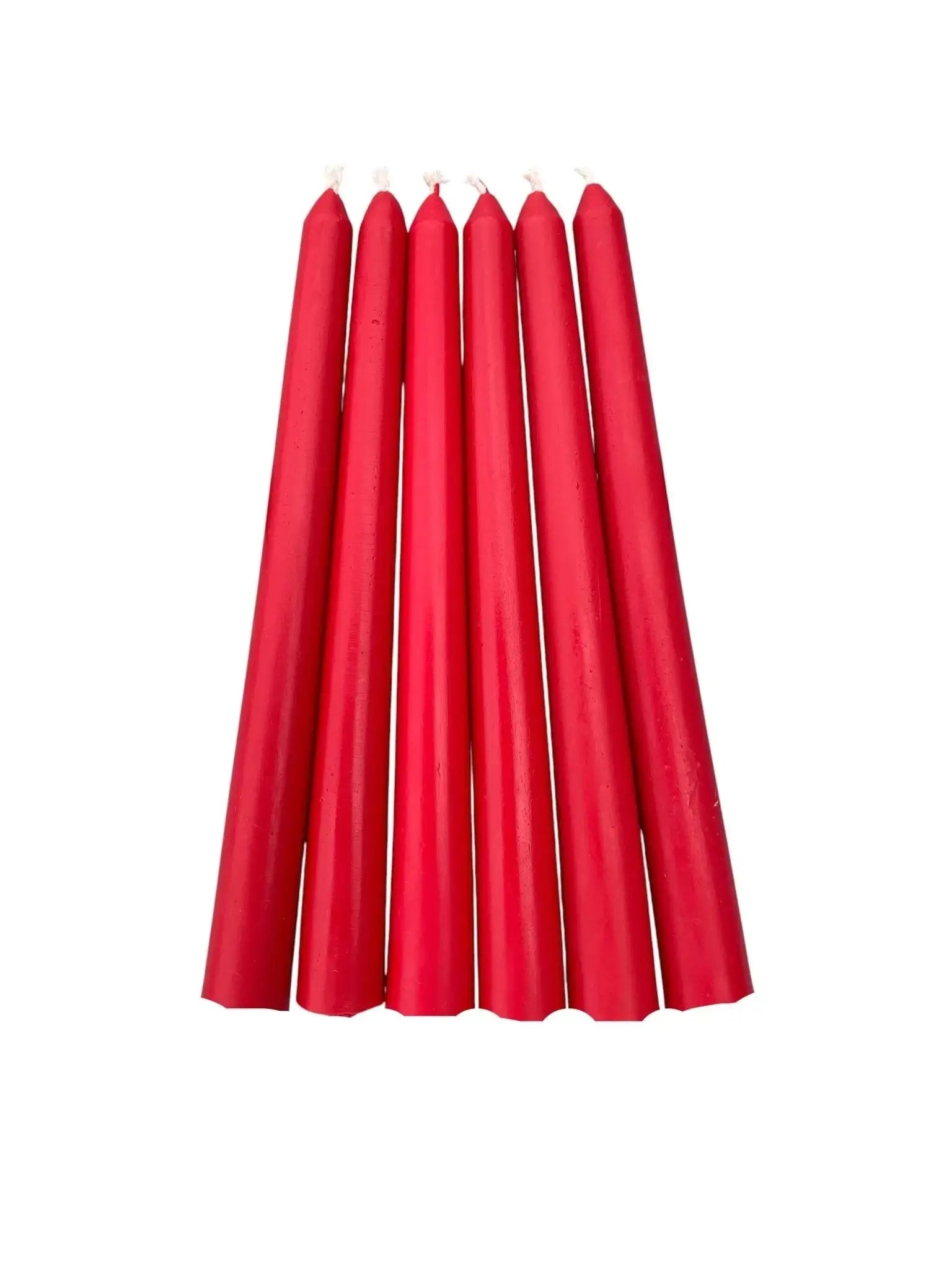 Six red taper beeswax candles arranged in a row on white background