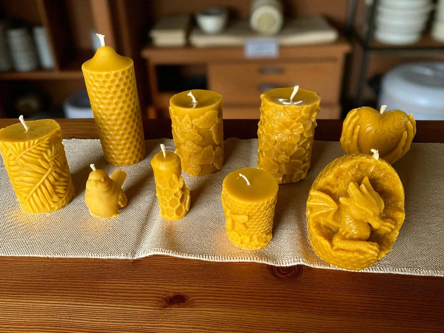A range of Beeswax Candles placed on a table - Mêl Llŷn