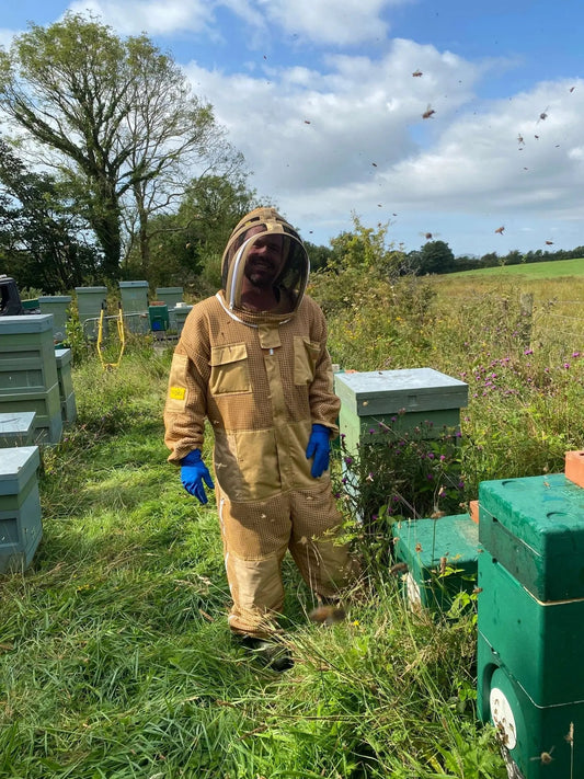 Our beekeeper tending to the hives