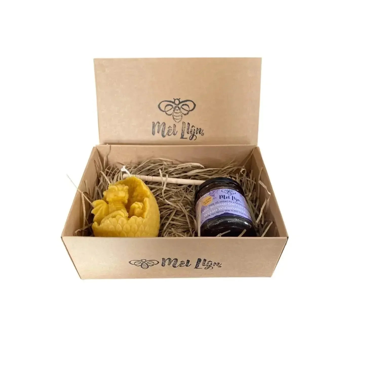 Mel Llyn gift box with artisan dragon egg beeswax candle, wildflower honey jar, and honey dipper